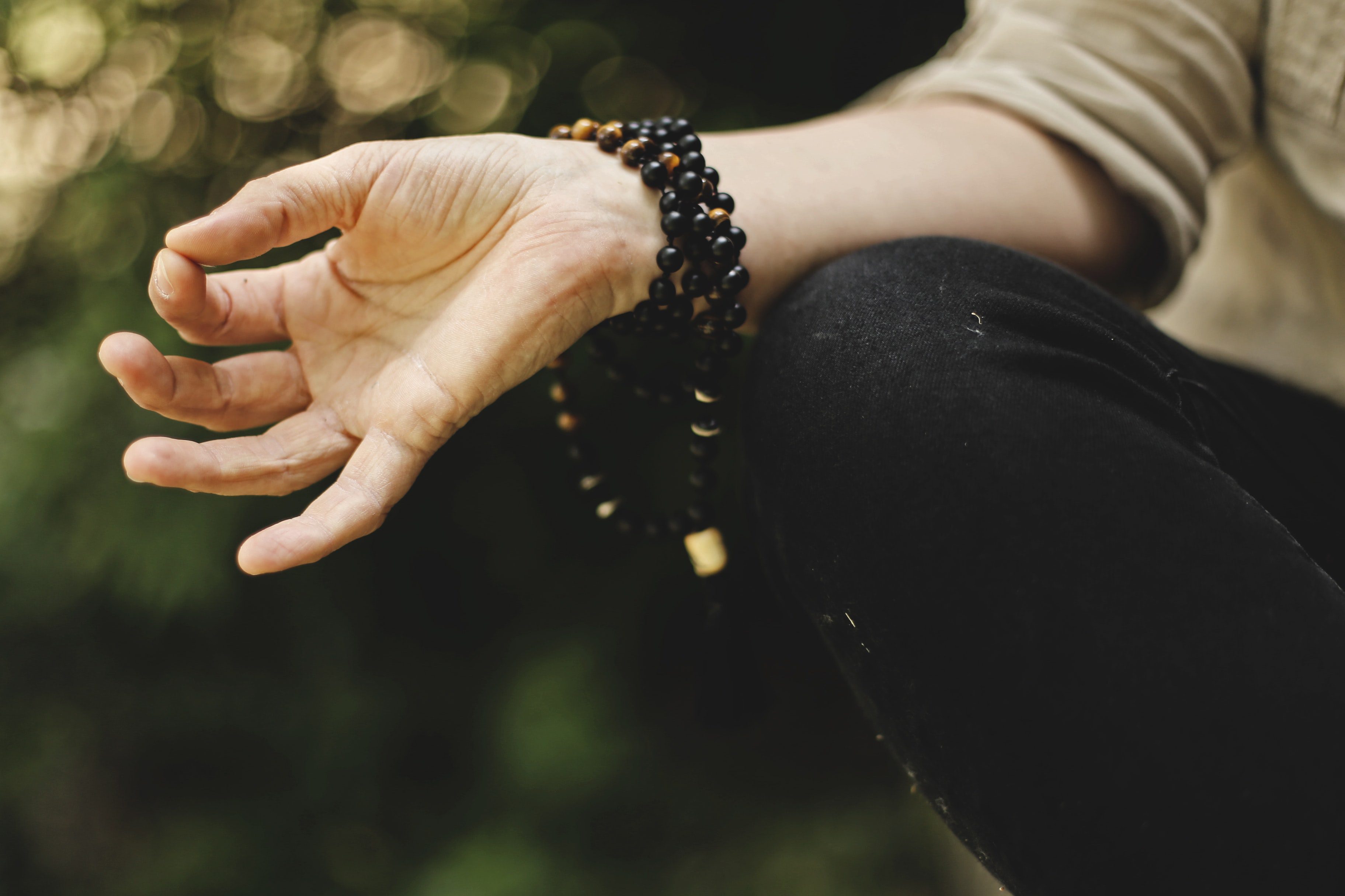 image showing a woman hand who is meditating
