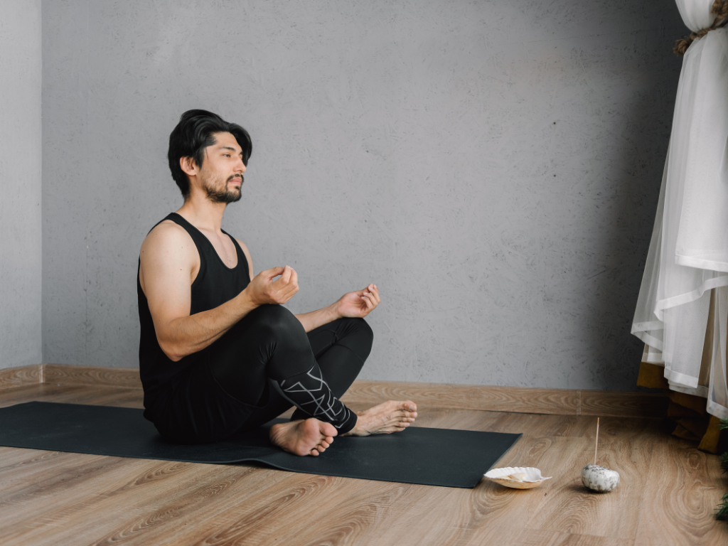 An image of a man performing meditation