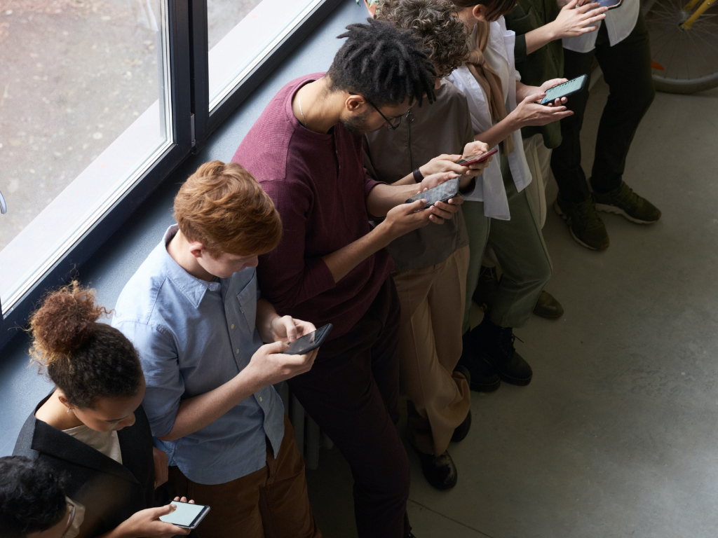 An image of group of people into their mobile world