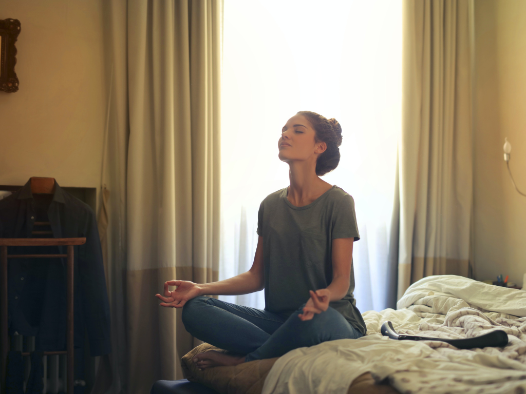 An image of a woman performing mindfulness meditation